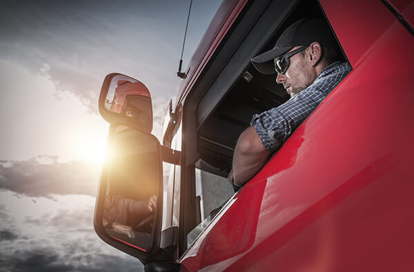 Meet our team at Quality Trailer Sales. Image of man sitting in truck